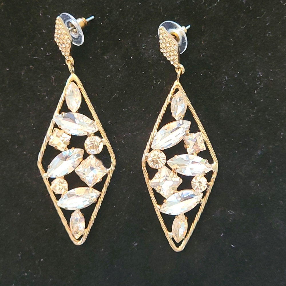 Diamond shaped earrings with crystals.